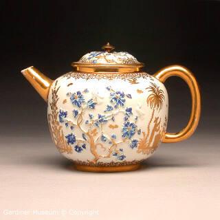 Teapot with raised florals and chinoiseries