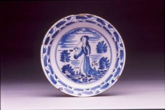 Plate with a woman smoking a pipe
