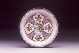 Plate with panelled design