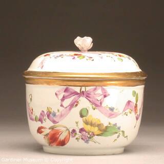 Sugar bowl with flowers and purple ribbons