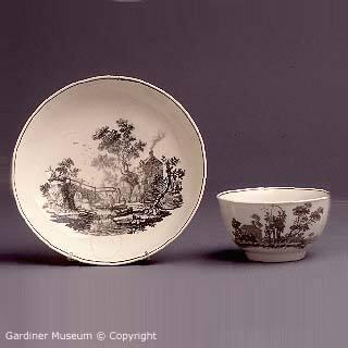 Tea bowl and saucer with "The Bridge House" and "The Bird Coop" patterns