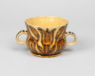 Two-handled cup with tulip motif