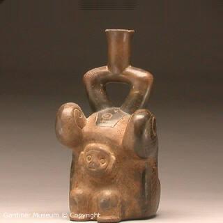 Stirrup-spout bottle with monkey and serpent