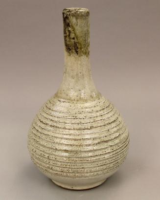 Large white vase with horizontal carving