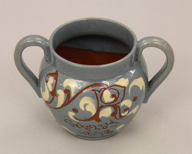 Two-handled cup with incised descriptions
