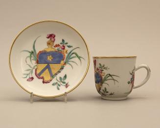 Cup and saucer with armorial crest