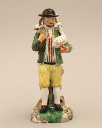 Figure of a farmer holding a goose
