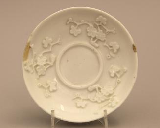 Tembleuse saucer with moulded prunus pattern