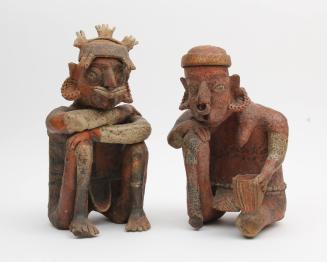 Emaciated Male and Female Seated Figures