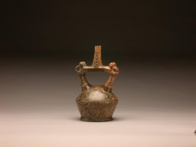 Stirrup spout bottle with monkeys and depiction of warriors