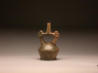Stirrup spout bottle with monkeys and depiction of warriors
