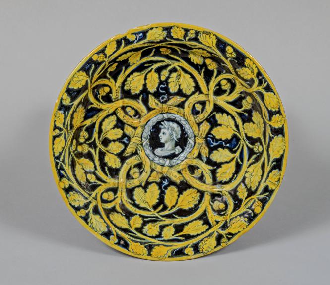 Moulded dish with portrait all'antica (in the antique manner) and oak branches