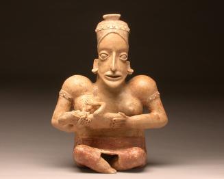 Figure of a mother nursing a child