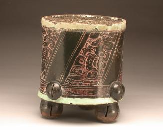 Tripod vase with incised motifs