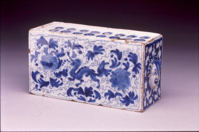 Flower brick with dragon and moulded masks