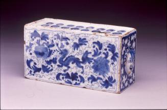 Flower brick with dragon and moulded masks