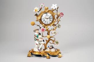 Clock with Harlequin with Bagpipes