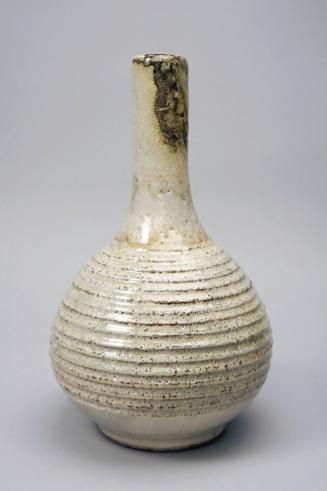 Large white vase with horizontal carving