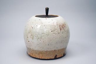 Covered jar with bronze lid, white pitted