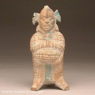 Whistle depicting a standing figure