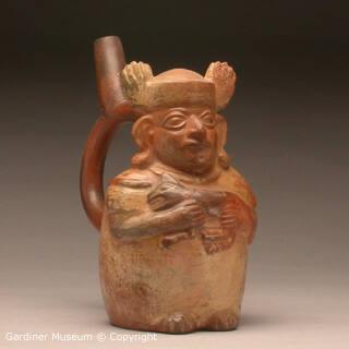Stirrup spout bottle with a man and a feline