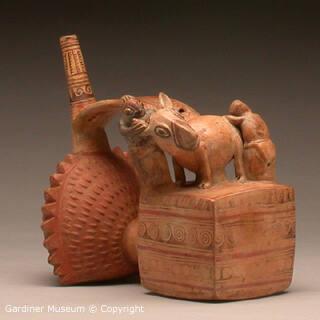 Double-chambered single spout bridge vessel with figural scene