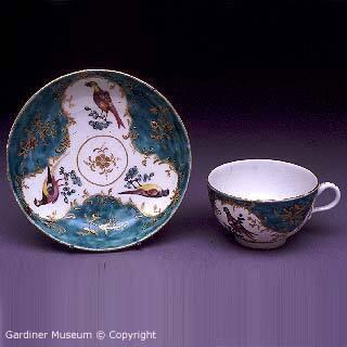 Teacup and saucer with birds and sea-green ground