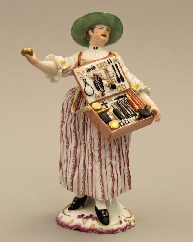 Figure of a trinket seller